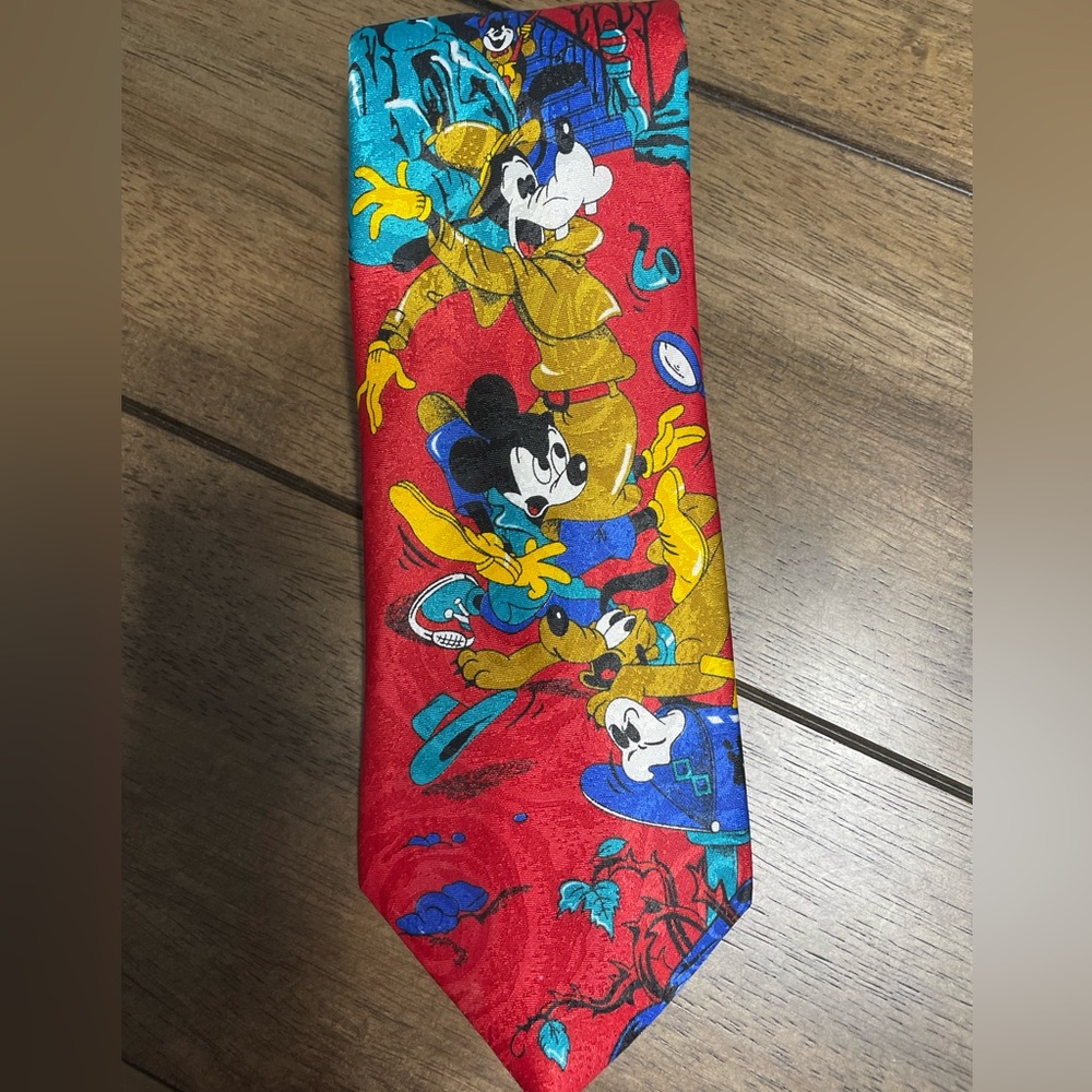 Official Disney tie features three classic characters Mickey, Goofy, Pluto.